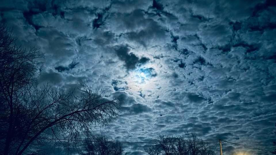 Cloudy sky on moonlit night