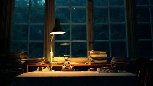 Desk near a window at night